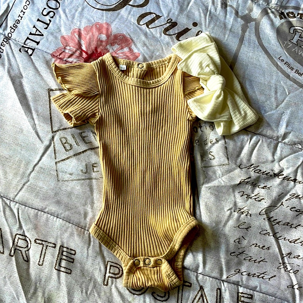 Beautiful tan newborn onesie with an off white headband to match